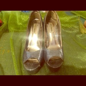 S M silver platform pumps with spike metal heels.